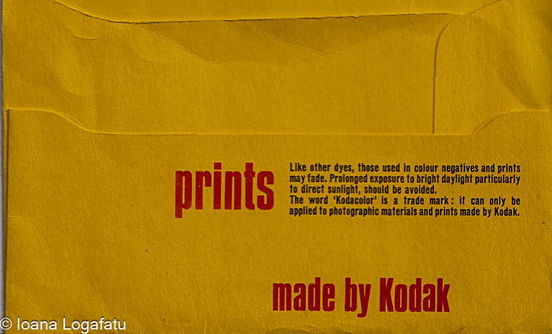 Bright yellow envelope containing color prints
