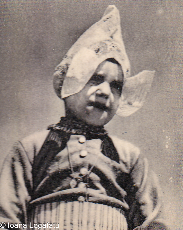 Child in traditional headwear outdoors