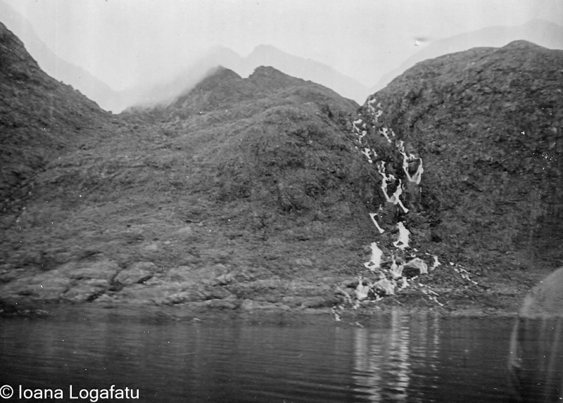 Serene mountain landscape with cascading waterfall