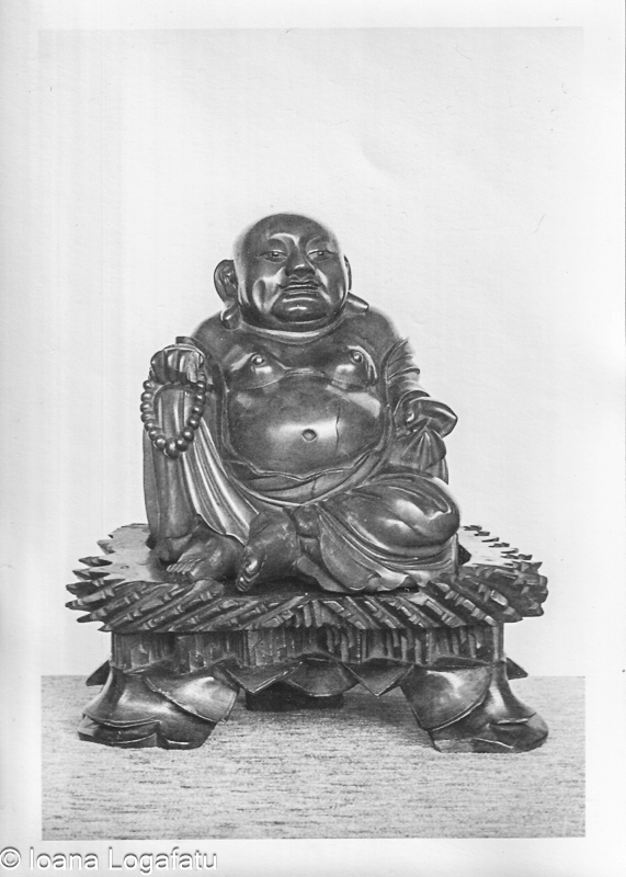 Intricate carved wooden Buddha statue
