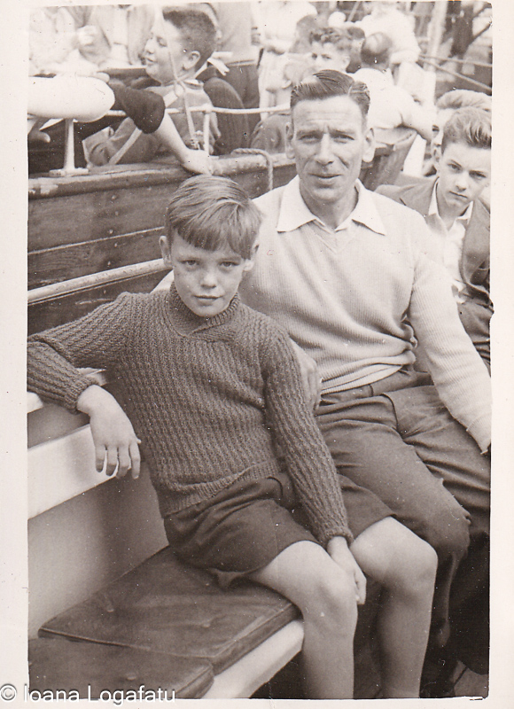 Father and son sharing a moment on a boat trip