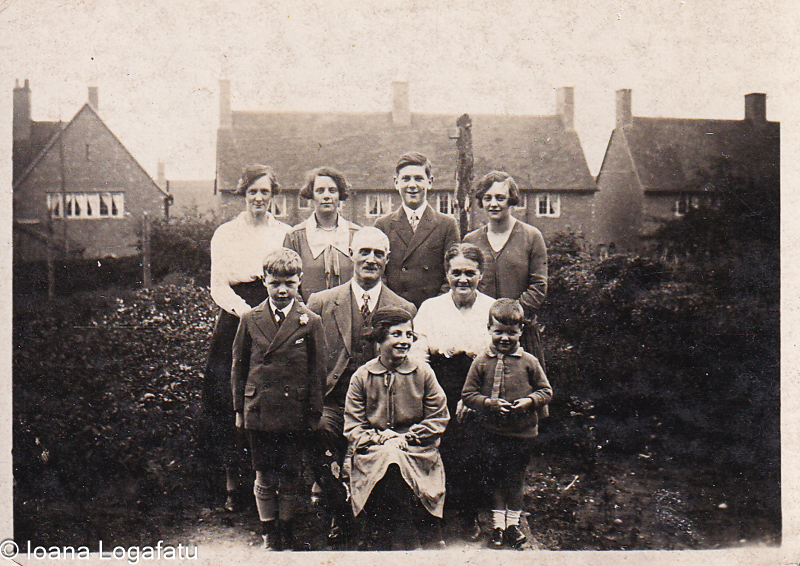 Family gathering in a historic garden setting