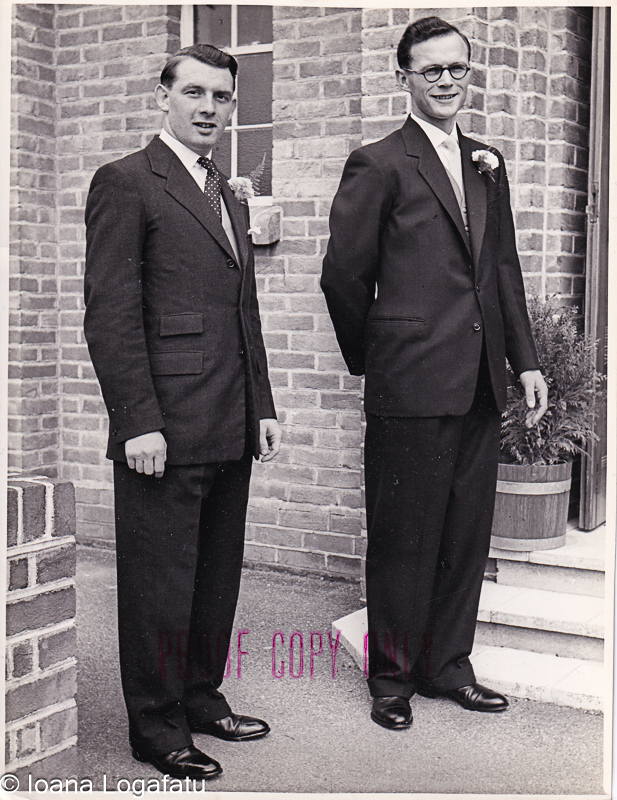 Stylish gentlemen pose together in classic suits