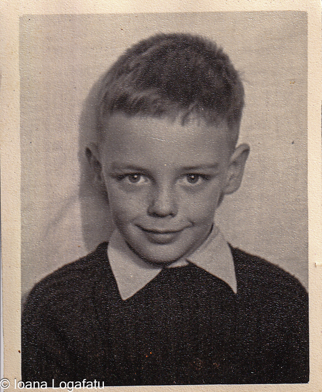 Young boy with a charming smile in black and white