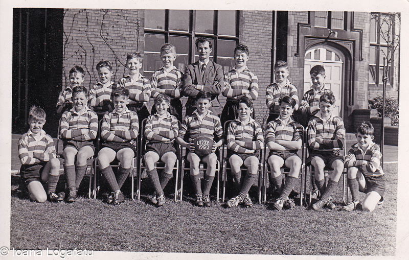 Young rugby team poses proudly at school in 1963