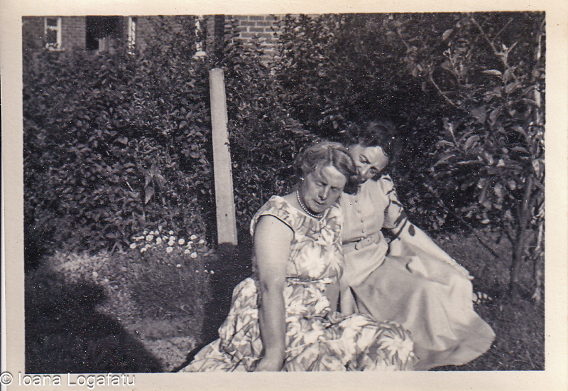 Two women enjoy a sunny garden moment together