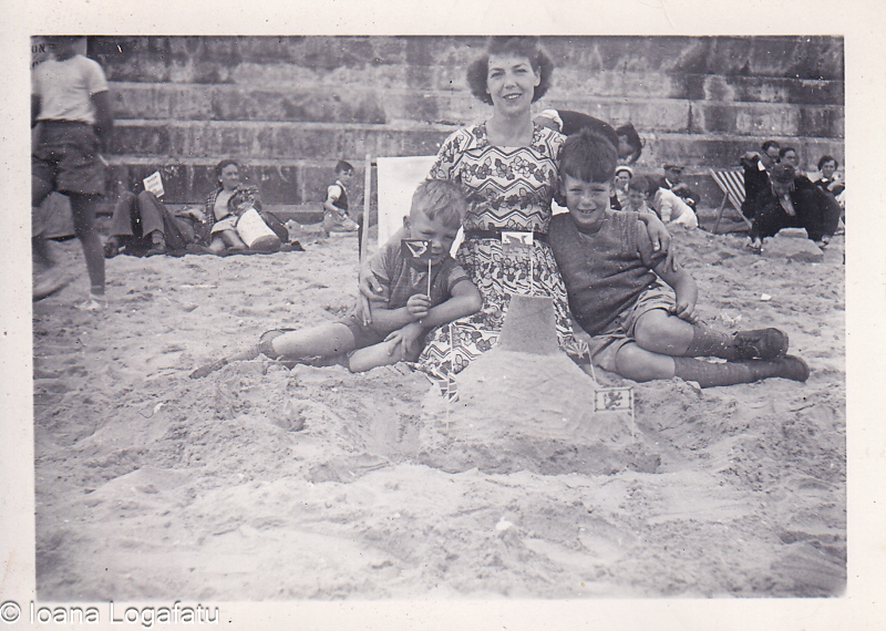 Family fun at the beach with sandcastle building