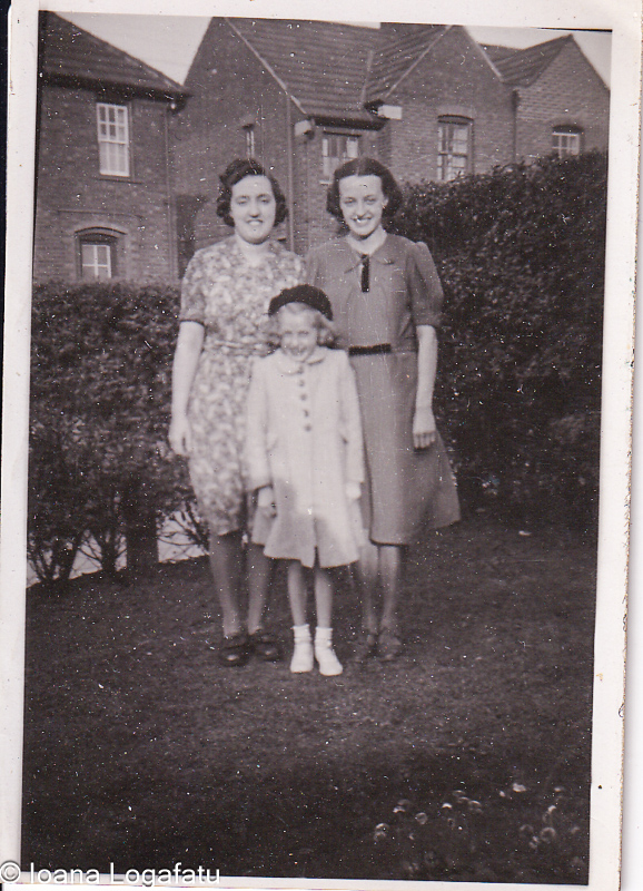 Three generations smiling in the sun