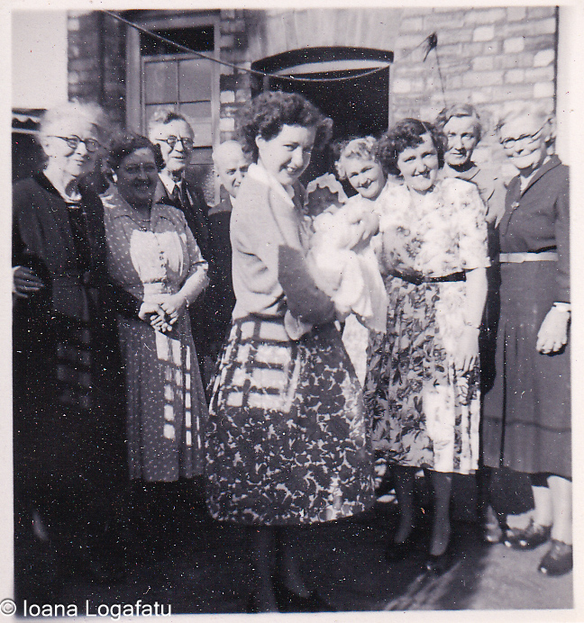 Joyful gathering of women and a baby in sunlight