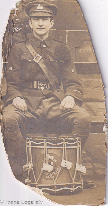 Soldier seated with drum during historic moment