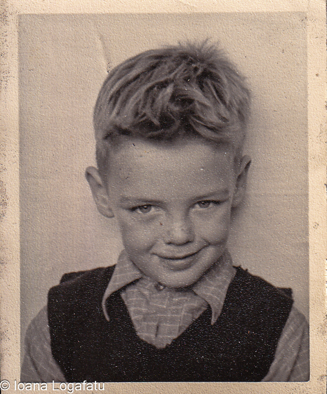 Young boy with stylish hair and playful smile