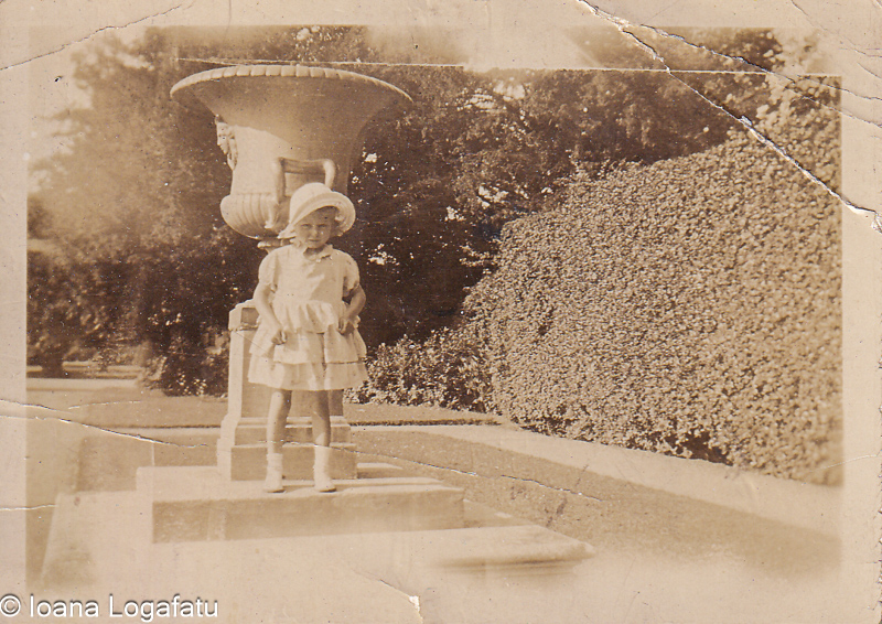 Little girl enjoying the sunny garden day