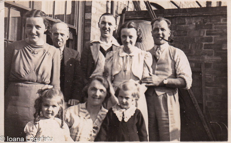 Family gathering in a sunny courtyard