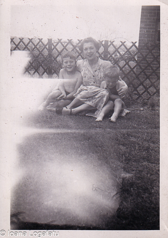 Mother and sons enjoying a sunny day in the yard