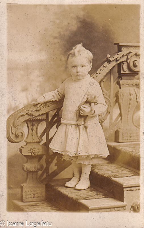 Girl in vintage dress on staircase