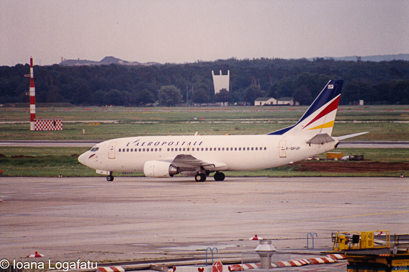 Airplane taxiing at the airport runway in daylight