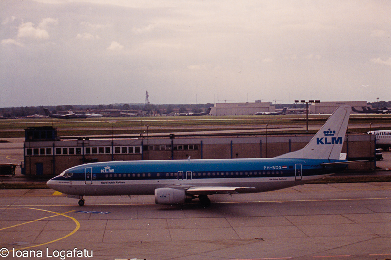 Old aircraft parked at the busy airport runway
