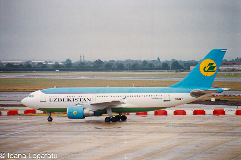 Uzbekistan Airways jet taxiing on a cloudy day