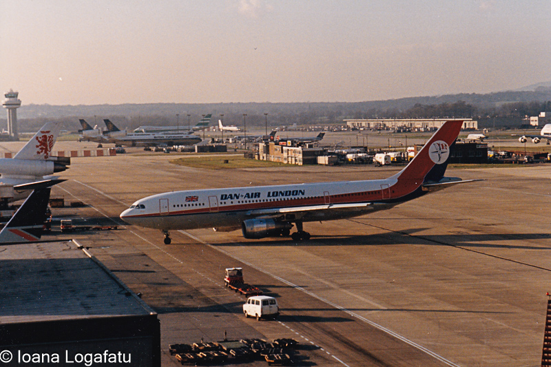 Vintage aircraft taxiing on a busy runway