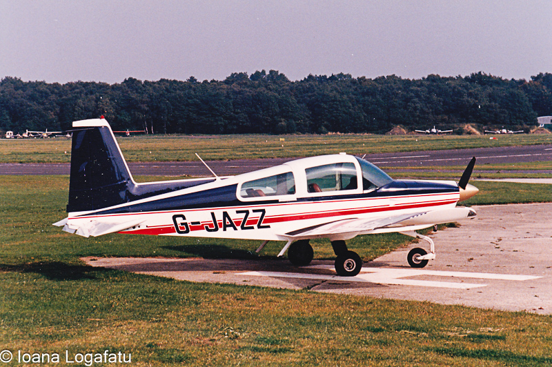 Small aircraft parked on the runway at dusk