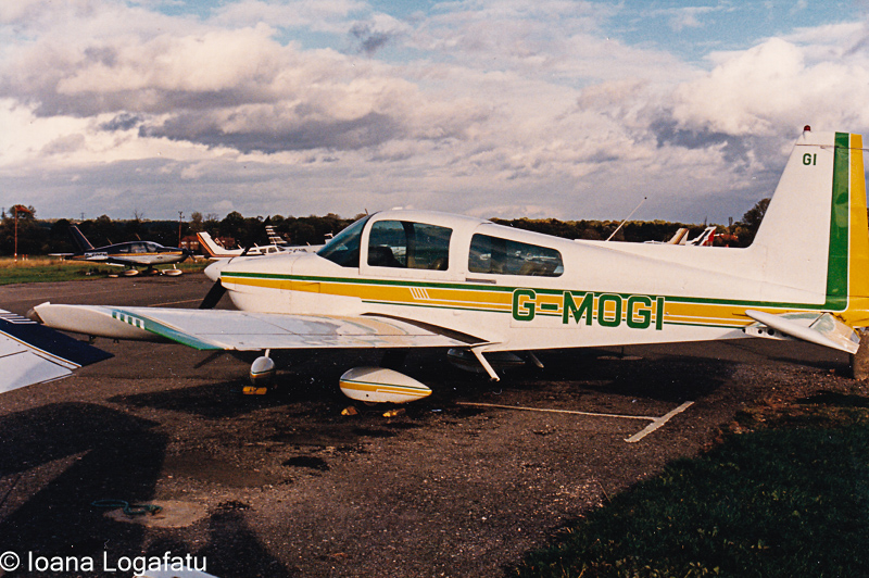 Vintage aircraft parked on a cloudy day