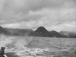 Scenic view of mountains over calm water