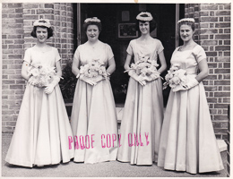 Elegant bridesmaids in vintage attire at a wedding