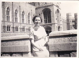 Smiling woman enjoying a sunny day at the castle