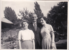 Gathering of friends in a sunny garden setting