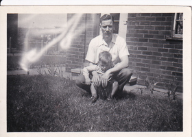 Memorable moment of a father and son in the yard