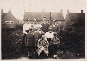 Family gathering in a historic garden setting