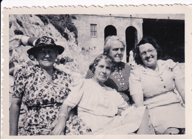 Four women enjoying a sunny day at the beach
