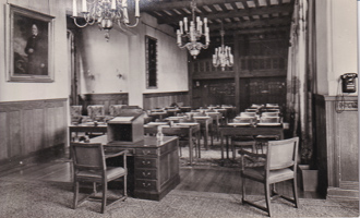 Historic classroom setting with wooden furniture