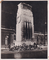 Floral tributes on night clock tower