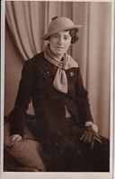 Vintage-clad woman posing elegantly