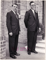 Stylish gentlemen pose together in classic suits