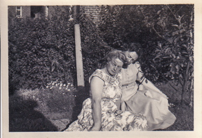 Two women enjoy a sunny garden moment together