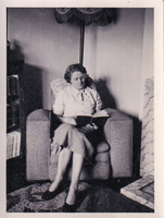 Woman reading quietly in a cozy living room