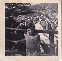 Girl admires nature at a waterfall