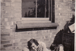 Enjoying a moment of quiet outside a brick wall