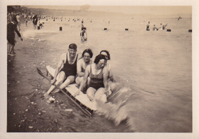 Vintage beach day with friends enjoying the water