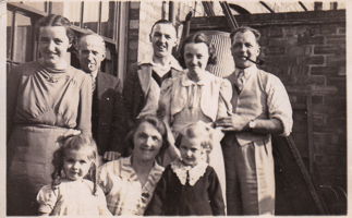 Family gathering in a sunny courtyard