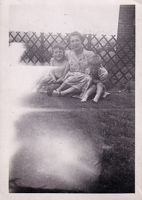 Mother and sons enjoying a sunny day in the yard
