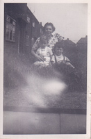 Joyful family moments in a grassy yard