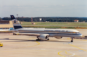 Vintage planes at busy airport terminal
