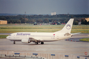 Airplane taxiing on a cloudy day at the airport