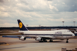 Jumbo jet at the airport, cloudy skies
