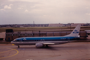 Old aircraft parked at the busy airport runway