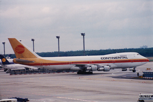 Vintage aircraft at bustling airport terminal