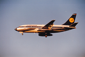 Plane lands at sunset in clear skies